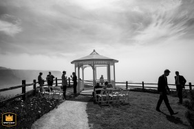 Silhouetted against the bright morning light just before the ceremony, the wedding guests gather at the iconic gazebo ceremony site at the Heritage House Resort and Spa in Mendocino, CA.